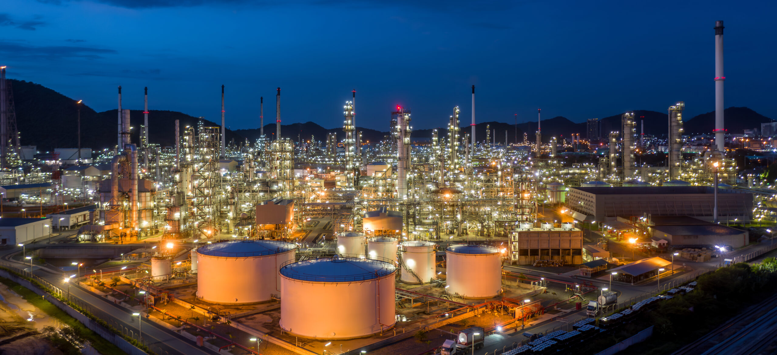 Aerial view oil and gas tank with oil refinery background at nig
